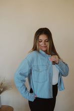 Load image into Gallery viewer, front view of model wearing the 90&#39;s mom shirt. model has the shirt paired with the used to know bodysuit in the color white and the Addison denim in the color fade black.