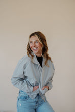 Load image into Gallery viewer, front view of model wearing the cherish the moment jacket in the color misty grey. model has the jacket paired with the never hesitate top in the color black and the charleston denim.