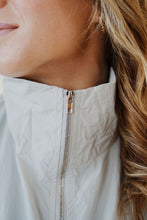 Load image into Gallery viewer, close up view of model wearing the cherish the moment jacket in the color misty grey. model has the jacket paired with the never hesitate top in the color black and the charleston denim.