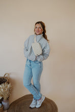 Load image into Gallery viewer, front view of model wearing the cherish the moment jacket in the color misty grey. model has the jacket paired with the never hesitate top in the color black, the no rules belt bag in beige, and the charleston denim.