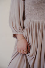 Load image into Gallery viewer, close detail view of model wearing the all my love maxi dress in the color taupe.