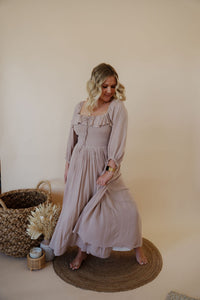front view of model wearing the all my love maxi dress in the color taupe.
