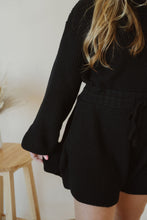Load image into Gallery viewer, detail view of model wearing the wouldn&#39;t change a thing romper in the color black.
