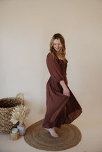 Load image into Gallery viewer, side view of model wearing the all my love maxi dress in the color chocolate.
