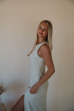 Load image into Gallery viewer, side view of model wearing the closer to love dress.