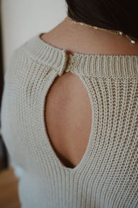 detail view of model wearing the wouldn't change a thing romper in the color taupe.