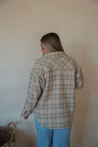 back view of model wearing the make things right shacket. model has the shacket paired with the forever yours tank in the color white and the genevive denim.