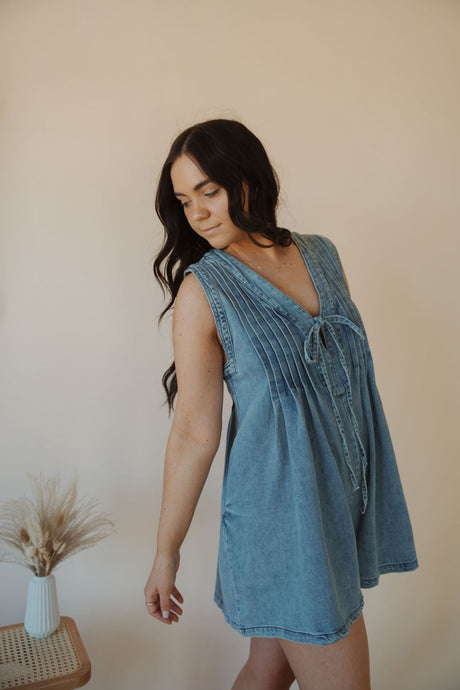 side view of model wearing the just a memory romper.