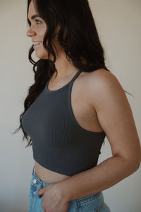 side view of model wearing the these days top in the color charcoal. model has the top paired with the dakota denim shorts.