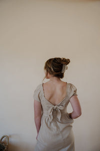 back view of model wearing the whispering willow dress.