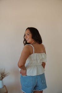 back view of model wearing the by the shore top. model has the top paired with the boston denim shorts.