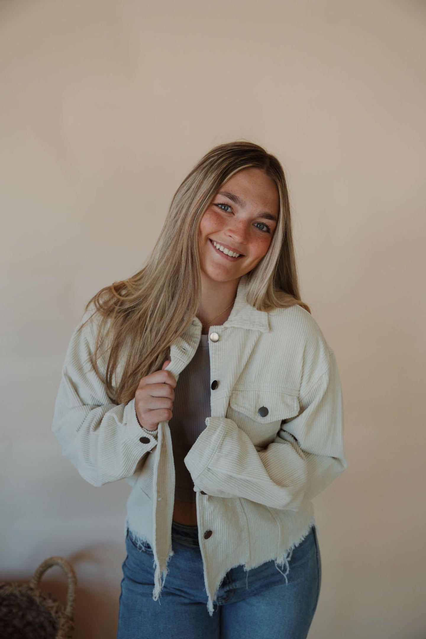 front view of model wearing the only just begun jacket in the color beige. model has the jacket paired with the forever yours tank in the color burnt taupe and the aurora denim.