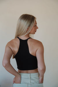 back view of model wearing the these days top in the color black. model has the top paired with the parker denim shorts.