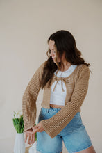 Load image into Gallery viewer, front view of model wearing the ocean avenue cardigan in the color taupe. model has the cardigan paired with the forever yours top in the color white and the austin denim shorts.