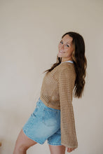 Load image into Gallery viewer, side view of model wearing the ocean avenue cardigan in the color taupe. model has the cardigan paired with the forever yours top in the color white and the austin denim shorts.