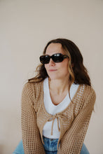 Load image into Gallery viewer, model wearing the onyx sunglasses in the color dark tortoise. model has the sunglasses paired with the ocean avenue cardigan in the color taupe, the forever yours top in the color white, and the austin denim shorts.