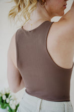 Load image into Gallery viewer, close back view of model wearing the change your mind bodysuit in the color walnut. model has the top paired with the parker shorts and the dainty mallory necklace.