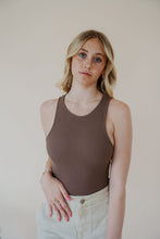 Load image into Gallery viewer, front view of model wearing the change your mind bodysuit in the color walnut. model has the top paired with the parker shorts and the dainty mallory necklace.