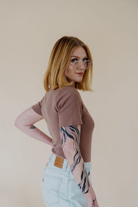 side view of model wearing the take a chance bodysuit in the color mocha.