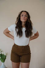 Load image into Gallery viewer, front view of model wearing the take a chance bodysuit in the color off white. model has the top paired with the hayden shorts and the anna necklace.