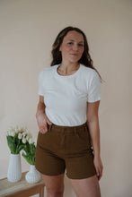 Load image into Gallery viewer, front view of model wearing the take a chance bodysuit in the color off white. model has the top paired with the hayden shorts and the anna necklace.