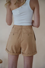 Load image into Gallery viewer, back detail view of model wearing the sweetest melody shorts in the color khaki. model has the shorts paired with the last to know top in the color white.