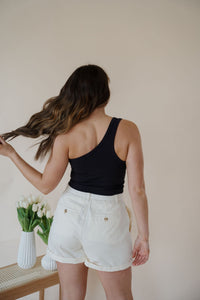 back view of model wearing the last to know top in the color black.