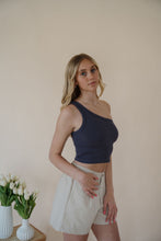 Load image into Gallery viewer, side view of model wearing the last to know top in the color asphalt grey.