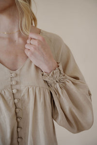 detail view of model wearing the keep you around dress.