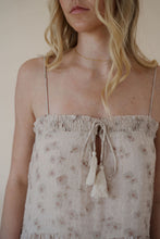 Load image into Gallery viewer, close view of model wearing the move along dress. model has the dress paired with the dainty mallory necklace.