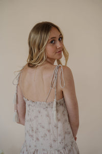 close back view of model wearing the move along dress. model has the dress paired with the dainty mallory necklace.