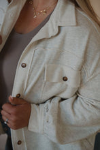 Load image into Gallery viewer, detail view of model wearing the never be the same shacket. model has the shacket paired with the change your mind bodysuit in the color smoky taupe.