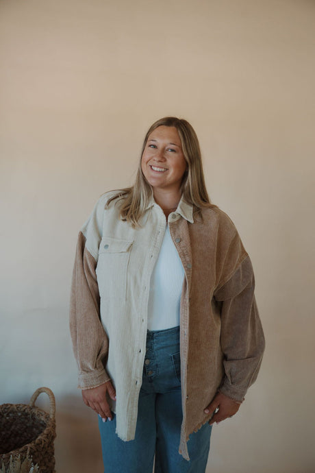 front view of model wearing the all we could be jacket. model has the sweater paired with the change your mind bodysuit in the color white.