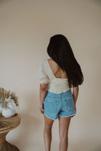 Load image into Gallery viewer, back view of model wearing the note to self top. model has the top paired with the boston denim shorts.