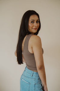 side view of model wearing the stay the same top in the color walnut. model has the top paired with the boston denim shorts.
