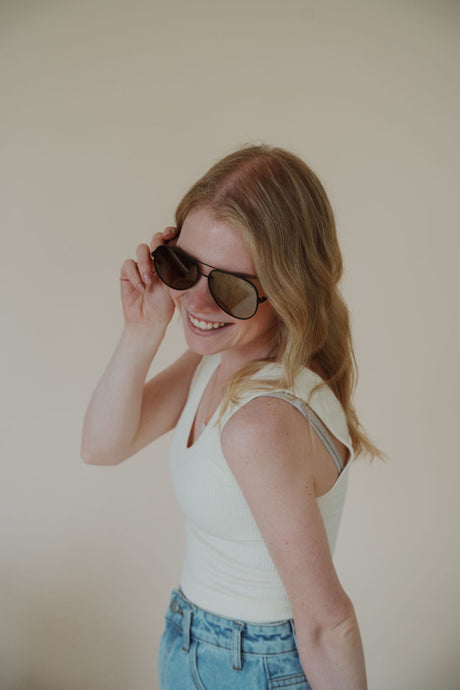 model wearing the max sunglasses in the color brown.