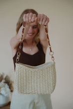 Load image into Gallery viewer, model holding the weekend getaway bag in the color cream.