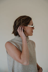 side view of model wearing the soho sunglasses in the color brown.