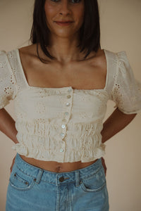 detail view of model wearing the note to self top. model has the top paired with the boston denim shorts.