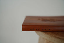 Load image into Gallery viewer, side binding view of the hosanna revival lined notebook in the Sierra theme.