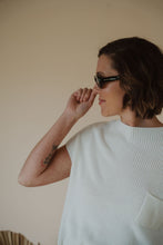 Load image into Gallery viewer, model wearing the noa sunglasses in the color black.