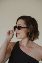 Load image into Gallery viewer, side view of model wearing the soho sunglasses in the color black.