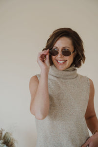 front view of model wearing the soho sunglasses in the color brown.