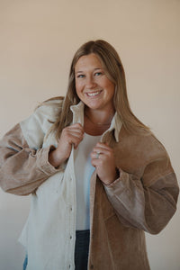 front view of model wearing the all we could be jacket. model has the sweater paired with the change your mind bodysuit in the color white.