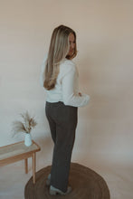 Load image into Gallery viewer, back view of model wearing the addison denim in the color brown. model has the denim paired with the everything to me sweater.