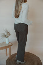 Load image into Gallery viewer, back view of model wearing the addison denim in the color brown. model has the denim paired with the everything to me sweater.