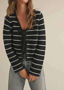 front view of model wearing the everything to me sweater in the black & white striped color combination.