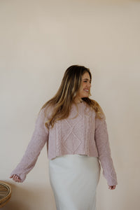 front view of model wearing the devoted sweater. model has the sweater paired  with the cherish satin maxi in the color ivory.