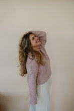 Load image into Gallery viewer, side view of model wearing the devoted sweater. model has the sweater paired  with the cherish satin maxi in the color ivory.