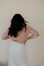 Load image into Gallery viewer, back view of model wearing the nothing to prove top in the color dusty pink. model has the top paired with the all over again cream denim midi skirt.